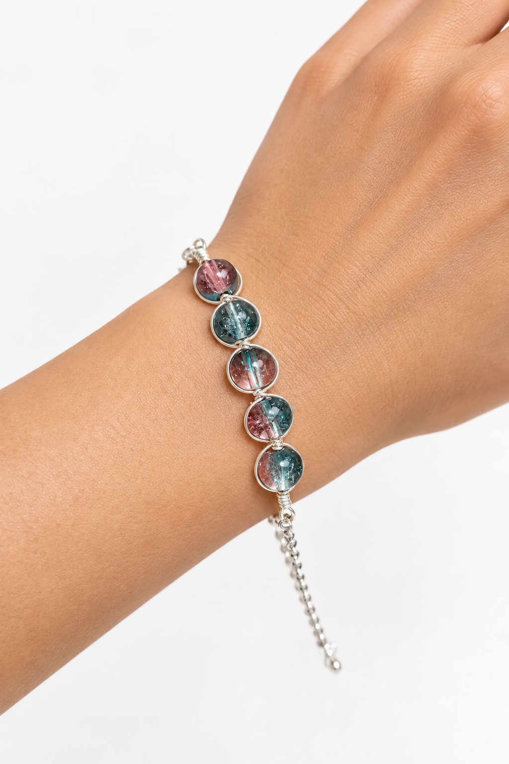 Aurora Kiss handmade teal and pink dual-colour glass bead bracelet in silver-toned copper wire.