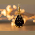 Black Resin Pendant – Golden-Toned Copper Wire Wrapped