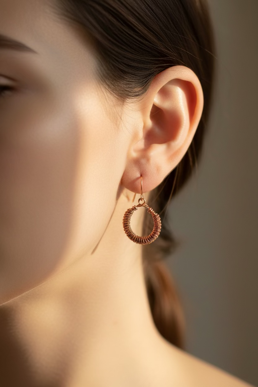 Woman wearing the handmade Copper Sonata earrings