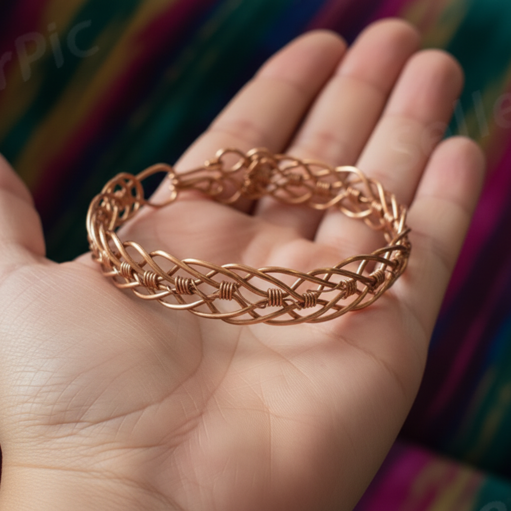 Rose gold braided bracelet on a hand with a colorful background