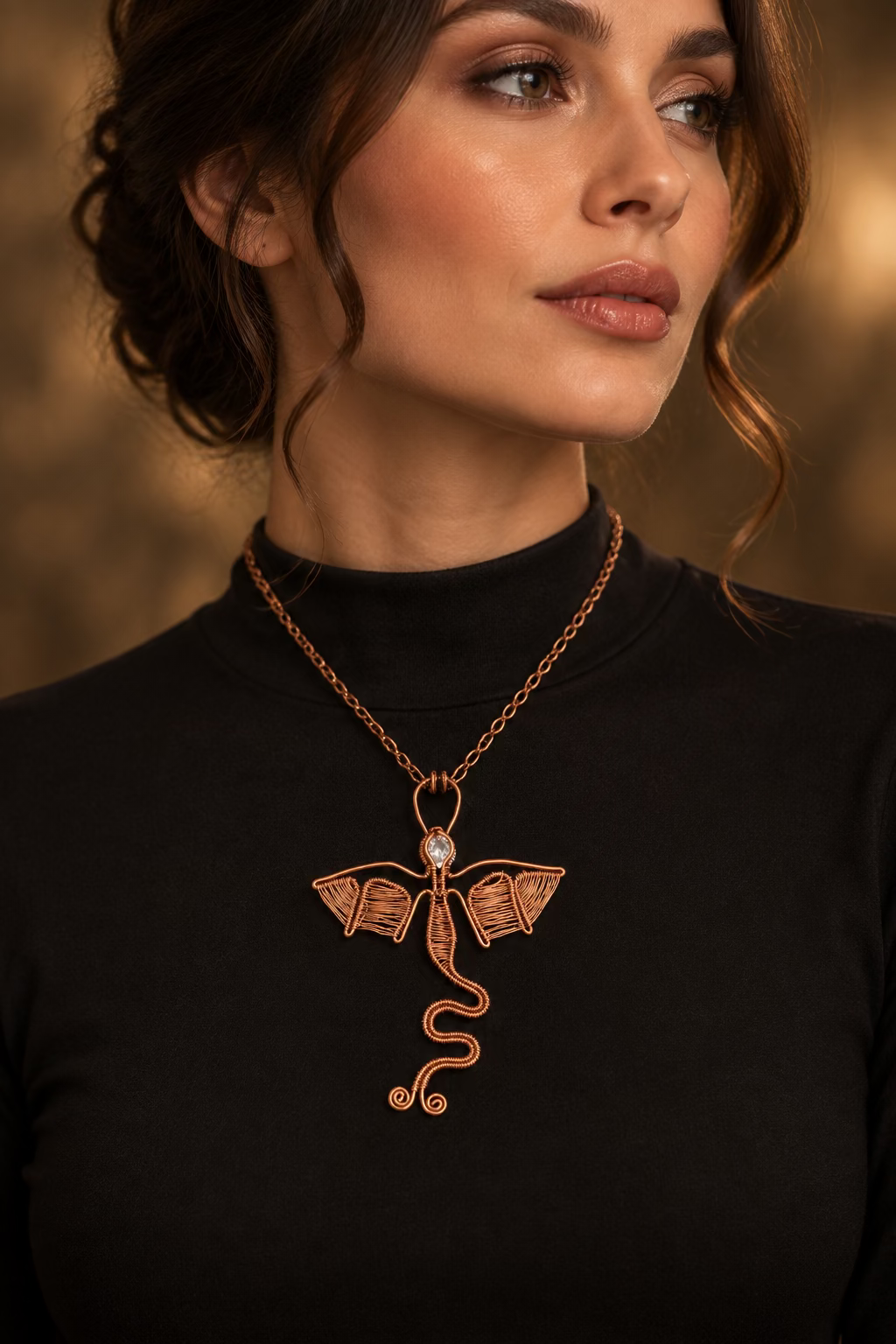 Model wearing the handmade Dragon Heart copper dragon pendant necklace with a sparkling zirconia gemstone on a copper-tone chain.