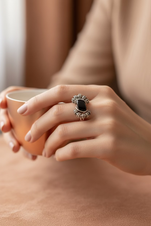 Gravity faceted hematite statement ring with crystal accents worn on finger