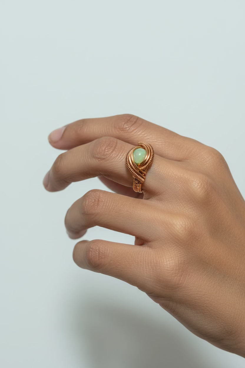 Model wearing the Jade Tide handmade green jade copper wire wrapped ring, highlighting its elegant fit and nature-inspired design