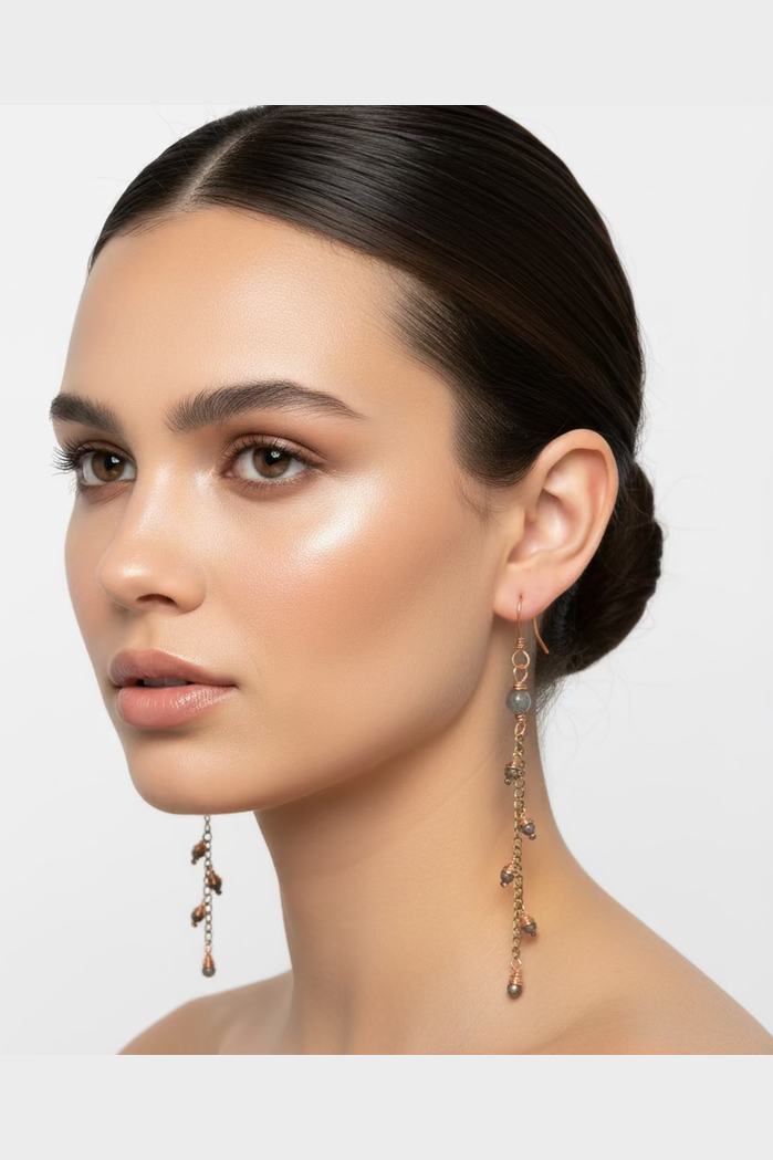 Model wearing Pyrite Bloom handmade copper and pyrite branch-inspired dangle earrings.