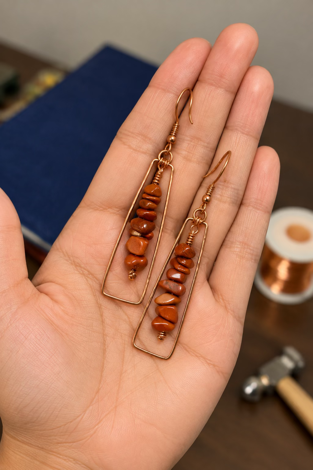 Terra Alchemy natural stone and copper earrings shown in hand
