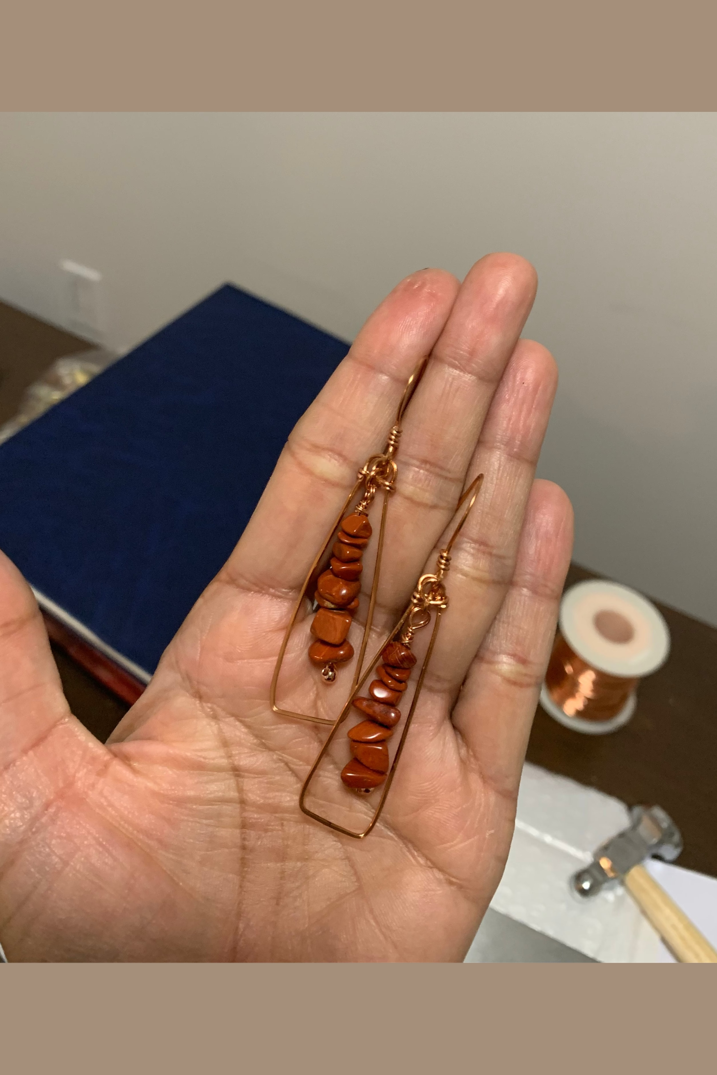 Terra Alchemy natural stone and copper earrings shown in hand