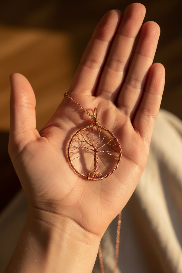 Wire tree pendant on a hand