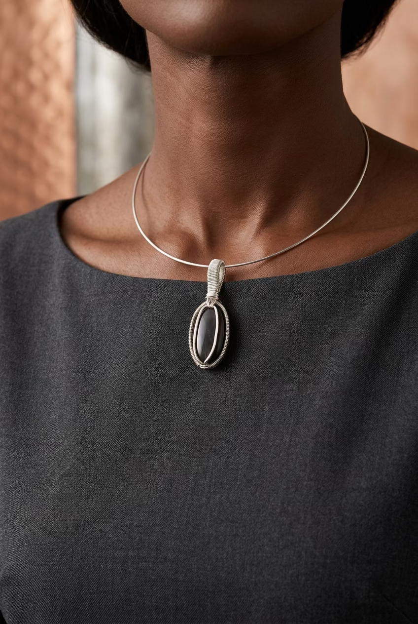 Handcrafted Twilight Aura labradorite pendant with violet flash in silver-toned copper wire wrapping.