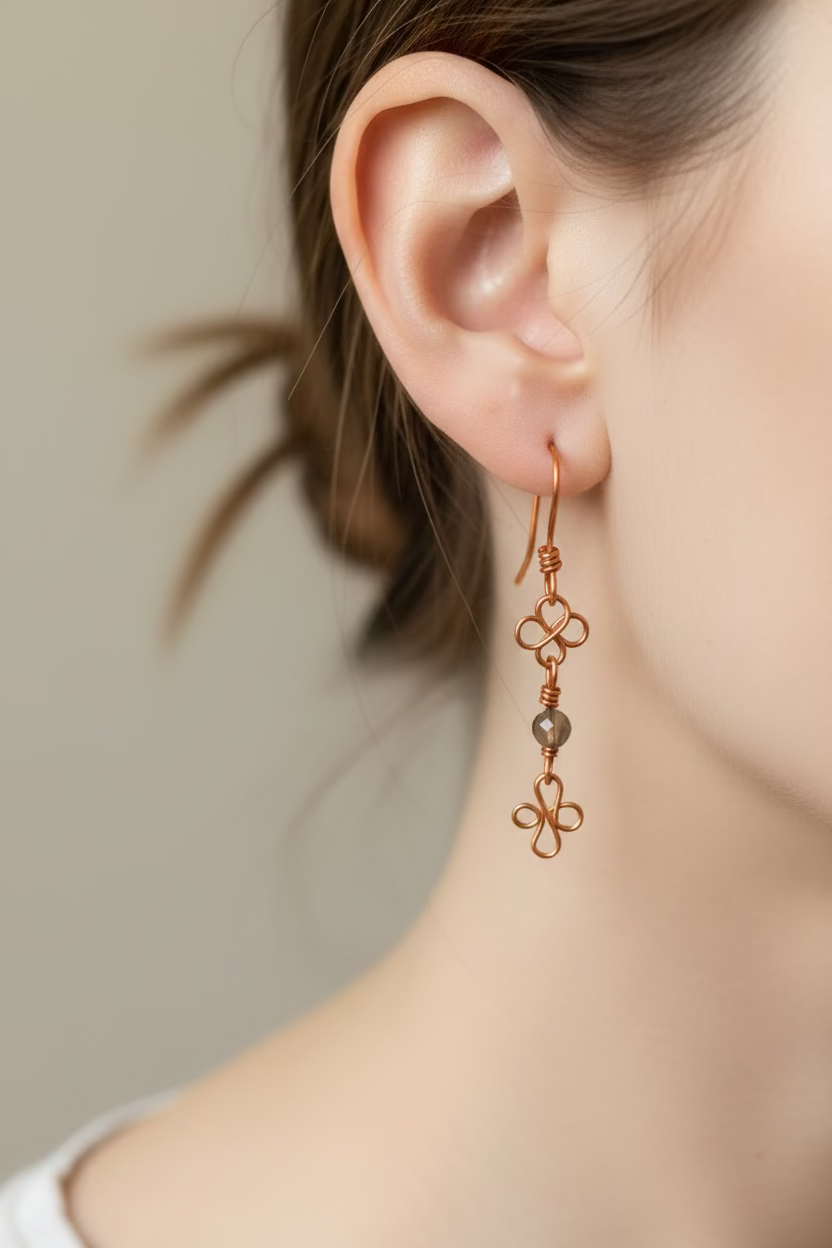 Women wearing clover whisper earrings